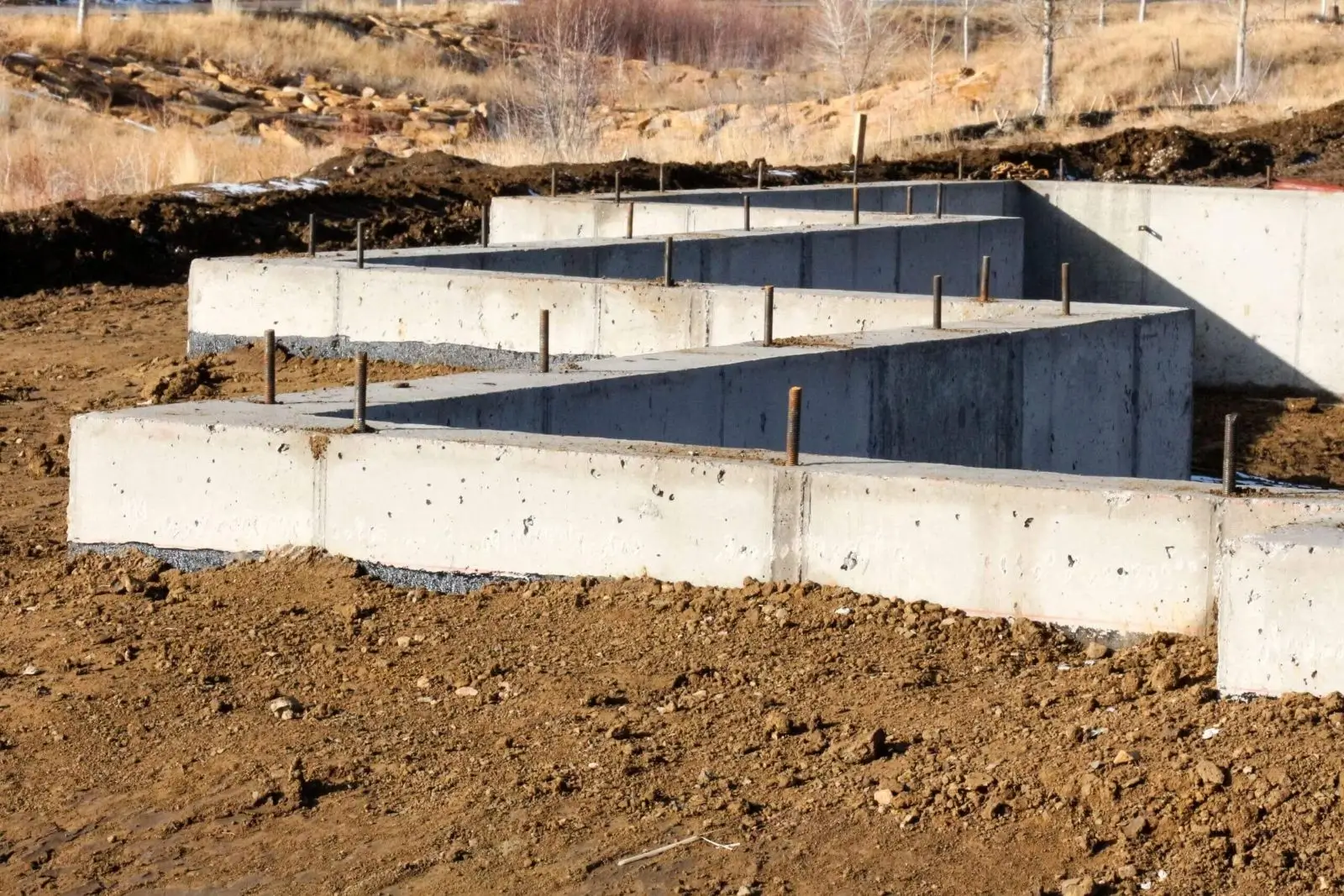 Zigzag concrete foundation walls on construction site